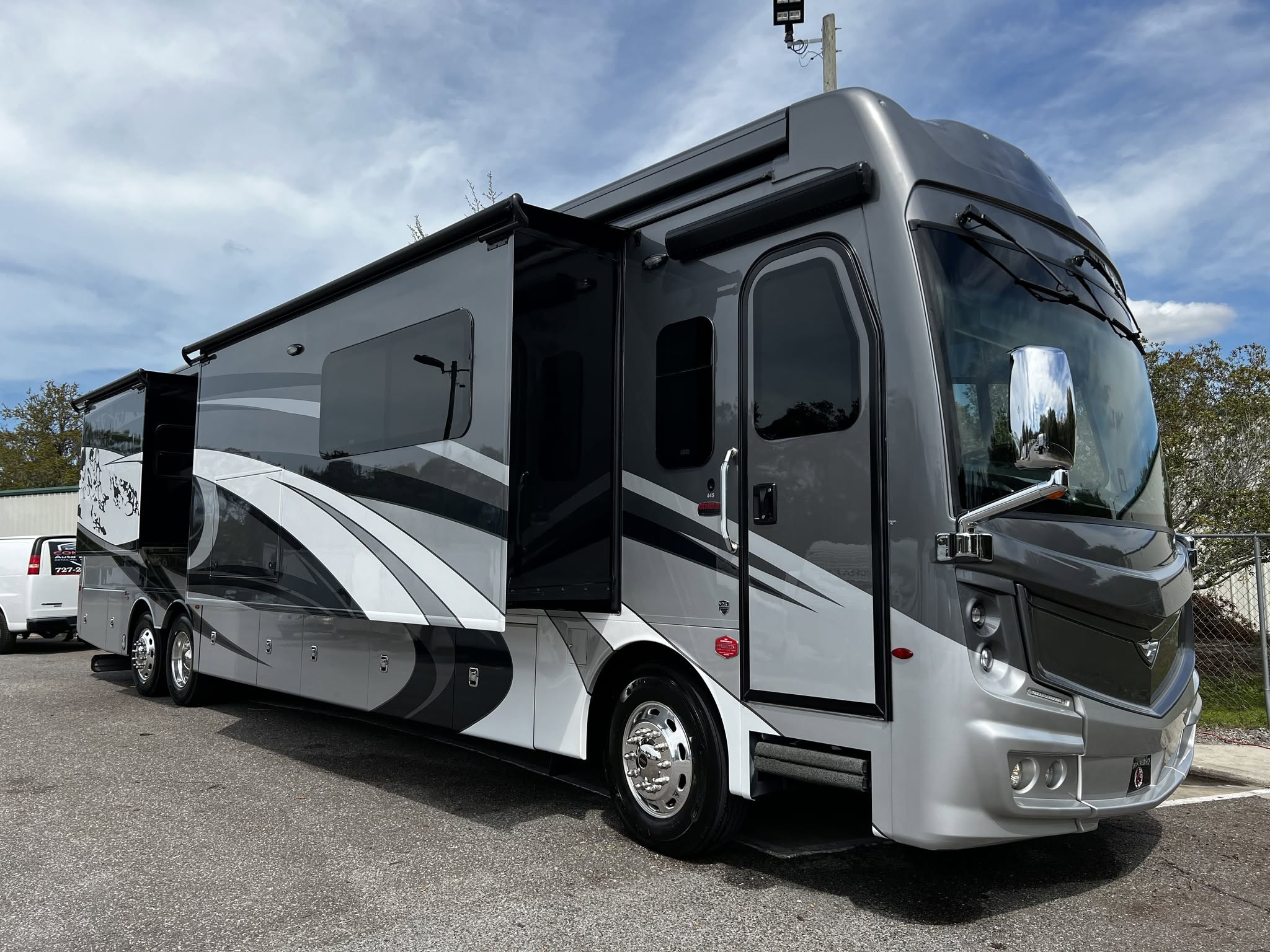 Class A luxury RV with glossy ceramic coating showing RV ceramic coating cost results Tampa