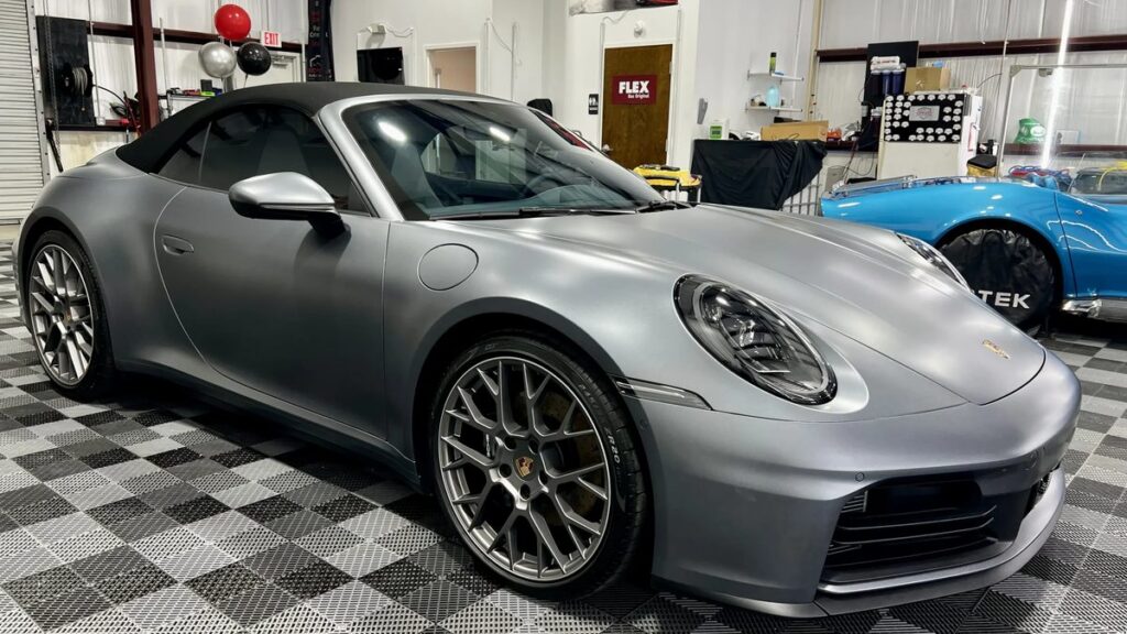 Silver Porsche sports car with paint protection film at Conforti Auto & Marine Detailing in Tampa Bay