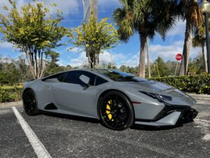 Gray Lamborghini Huracan with black wheels and PPF Tampa protection in parking lot