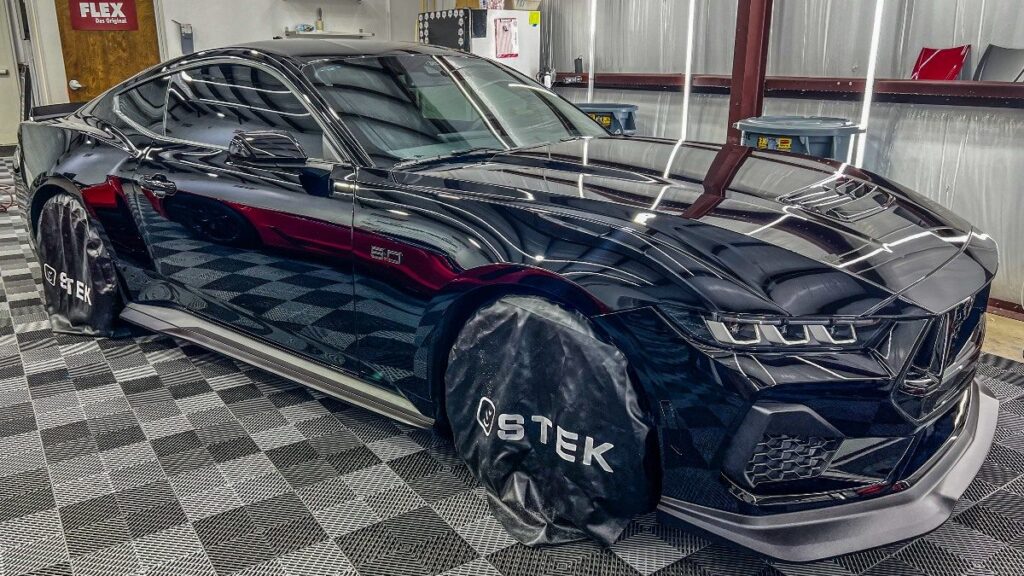 Dark luxury car with paint protection film at Conforti Auto & Marine Detailing in Palm Harbor, FL