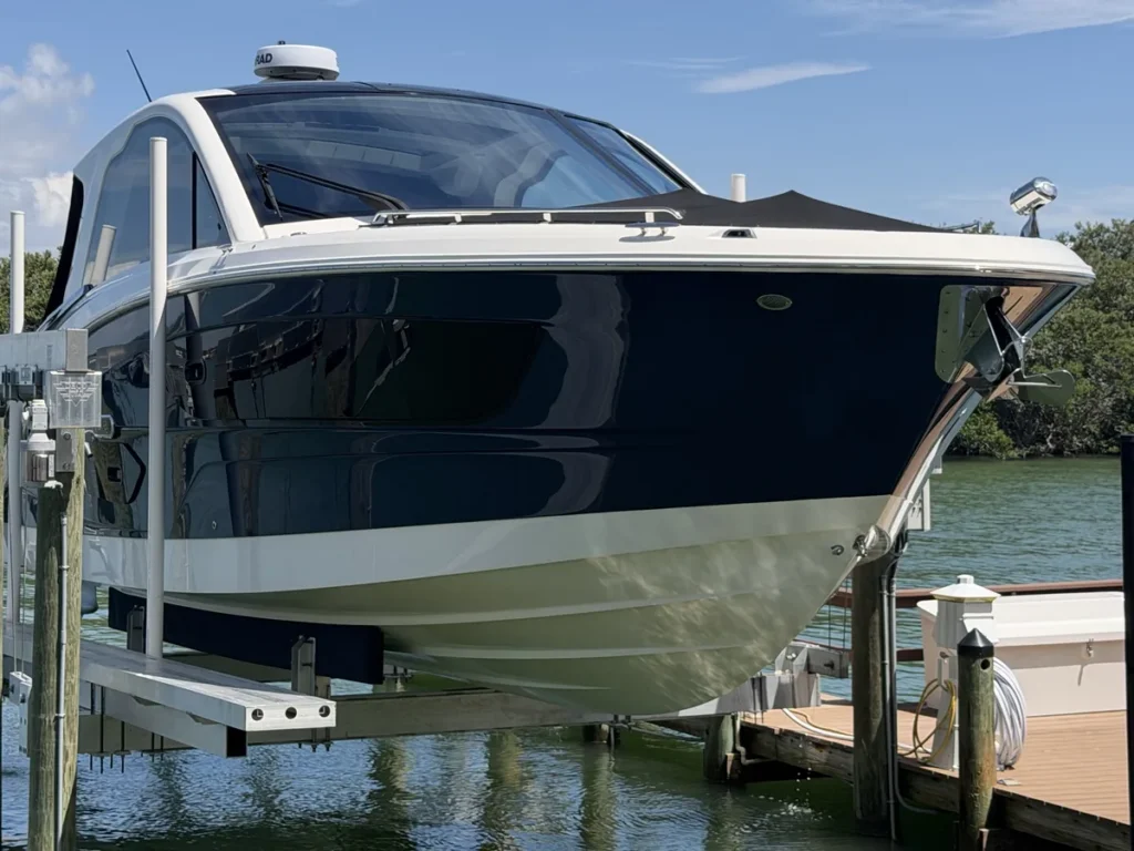Sea Ray hauled out on a boat lift for gelcoat correction and ceramic coating, Tampa Bay