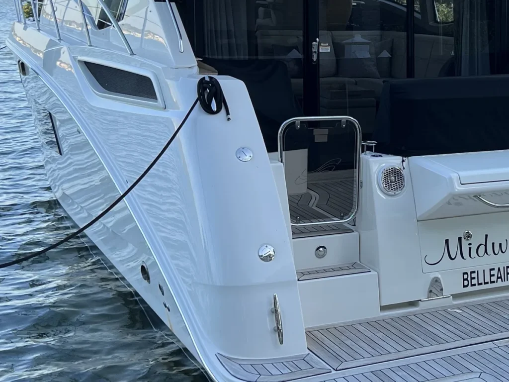 Glossy white gelcoat on a Sea Ray Sundancer hull after ceramic coating