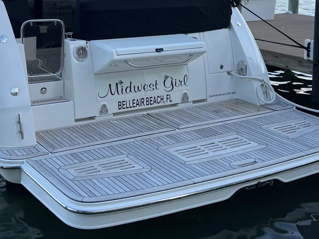 Transom and teak swim platform of a Sea Ray Sundancer out of Belleair Beach, Florida